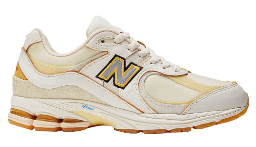 New Balance 574 Beżowo-złote buty sportowe na koturnie